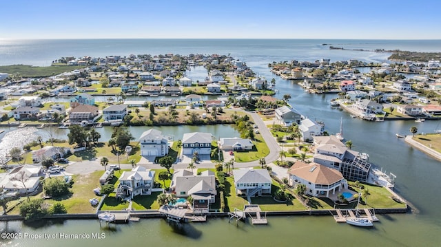 aerial view with a water view and a residential view