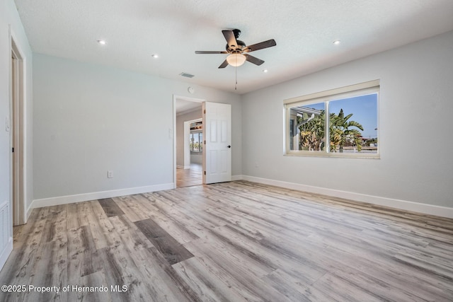 unfurnished bedroom with visible vents, baseboards, light wood-style flooring, ceiling fan, and recessed lighting