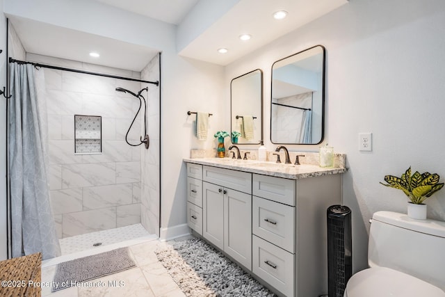 bathroom with tiled shower, toilet, marble finish floor, vanity, and recessed lighting