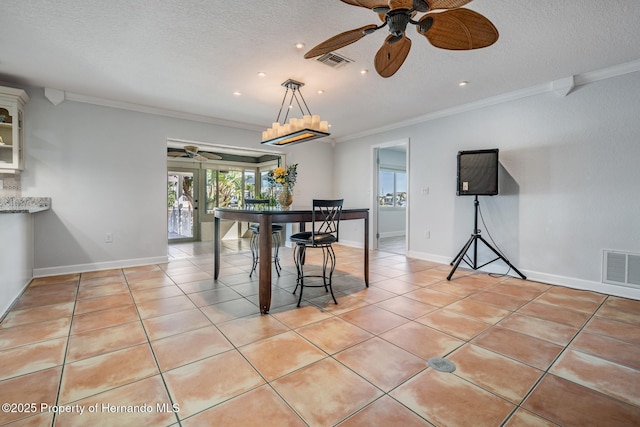 dining room with visible vents, a textured ceiling, and light tile patterned floors