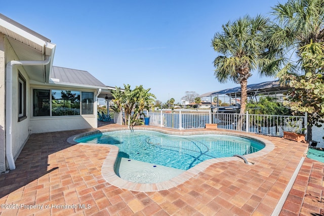 view of pool with a patio area, fence, and a fenced in pool