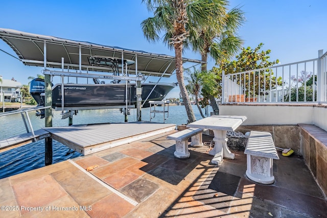 view of patio with a boat dock, a water view, and boat lift