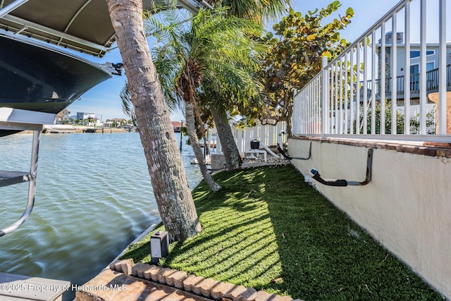 exterior space featuring a yard and a water view