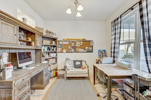 office space featuring an inviting chandelier and built in desk