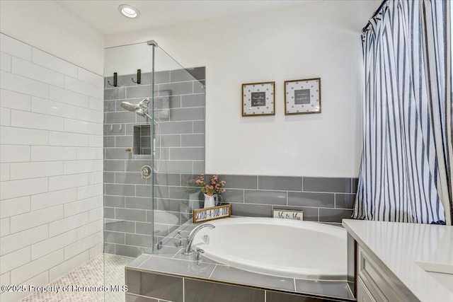 full bath featuring a garden tub and a walk in shower