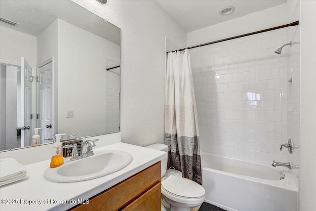 bathroom featuring vanity, shower / tub combo, toilet, and visible vents