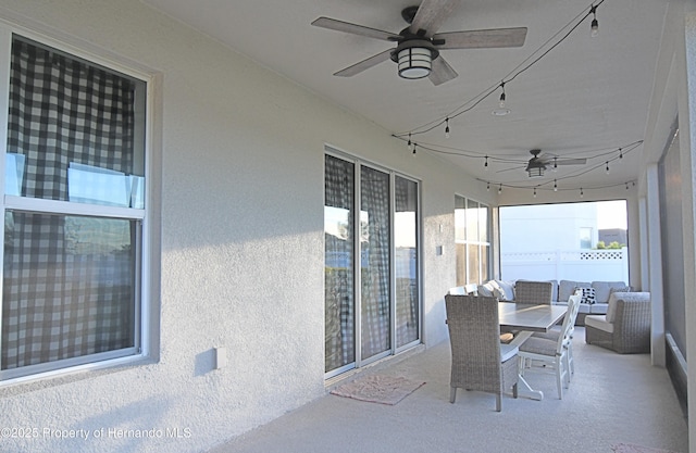 sunroom with a ceiling fan