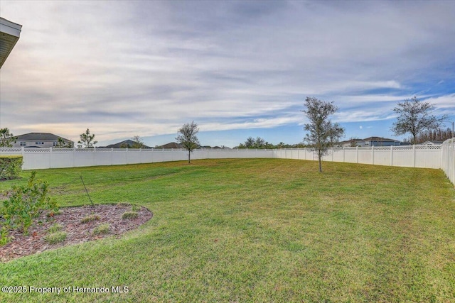 view of yard with a fenced backyard