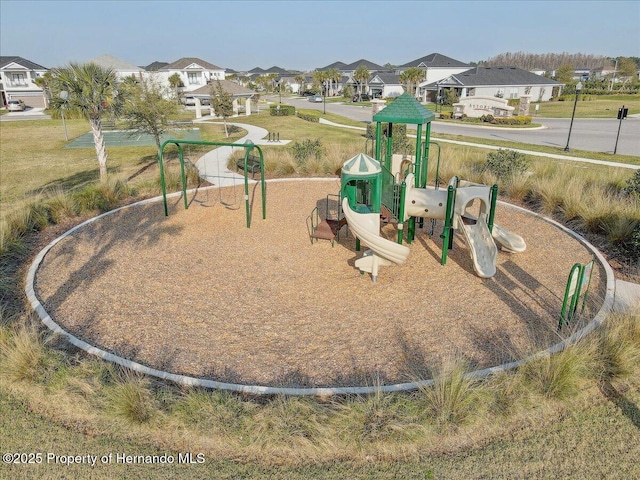 communal playground featuring a residential view