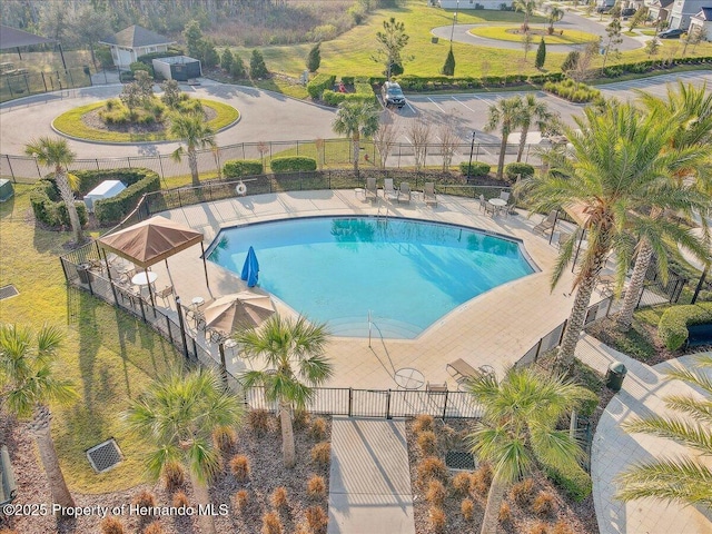 pool featuring a patio area and fence