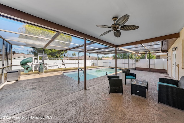 view of pool featuring a patio, a fenced backyard, a playground, and a lanai