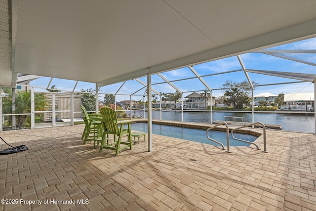 exterior space featuring a water view and a pool