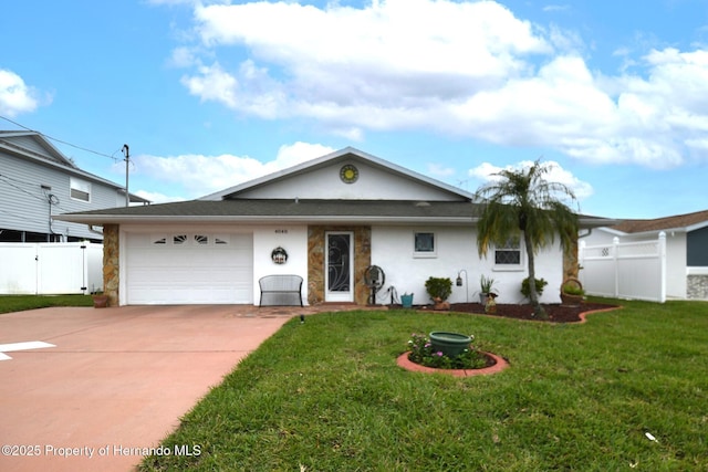 ranch-style house featuring stucco siding, a front yard, fence, a garage, and driveway