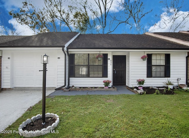 ranch-style home featuring driveway, a shingled roof, a garage, and a front lawn