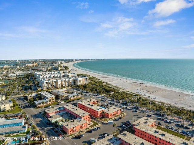 aerial view with a city view, a beach view, and a water view