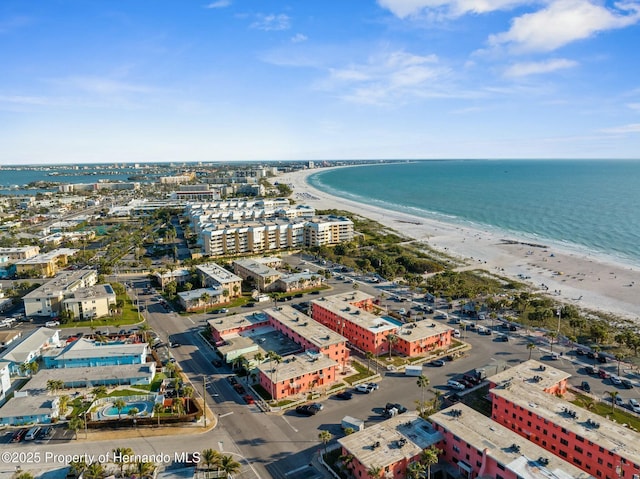 aerial view featuring a city view, a water view, and a beach view