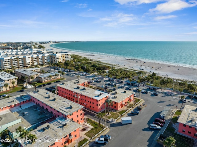 bird's eye view featuring a beach view and a water view