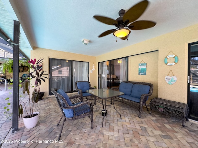 view of patio featuring a ceiling fan