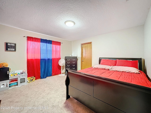 carpeted bedroom with a textured ceiling