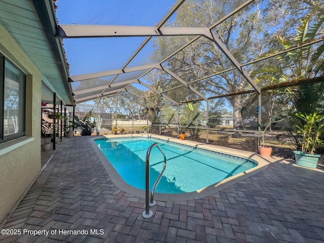 pool with a patio and a lanai