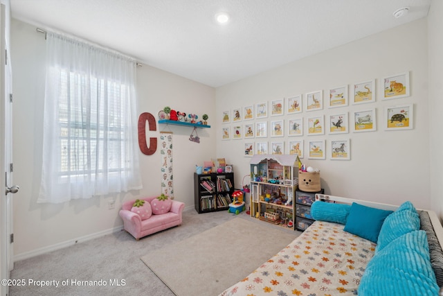 carpeted bedroom with baseboards