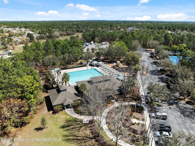 drone / aerial view featuring a view of trees