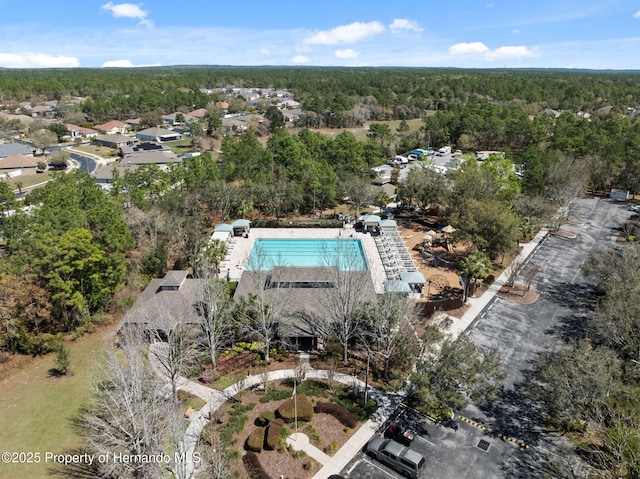 bird's eye view featuring a forest view