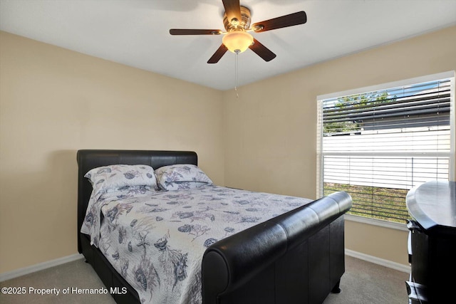 bedroom featuring carpet, baseboards, and ceiling fan