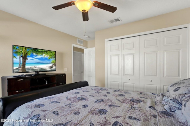 bedroom featuring visible vents, a closet, and a ceiling fan