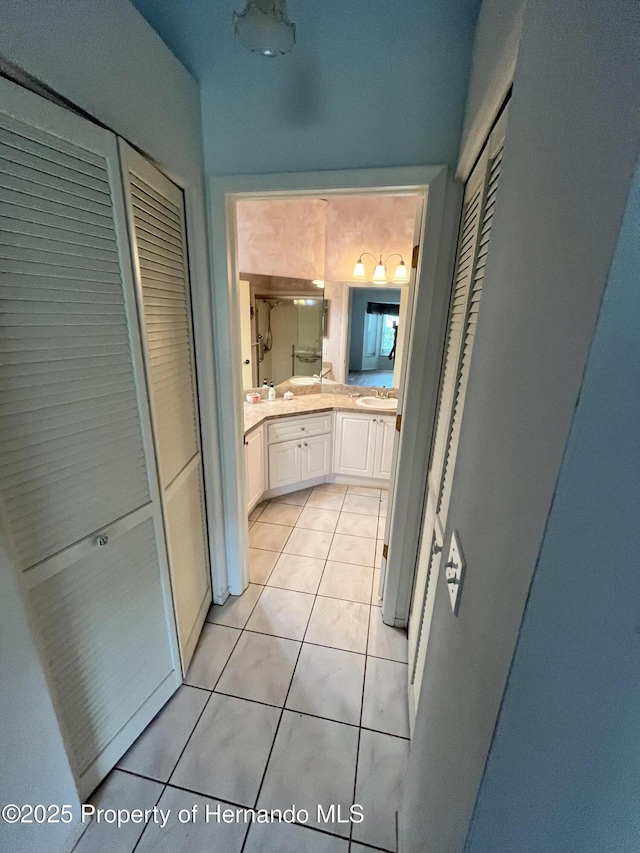 7441 Baywood Forest Cir, Spring Hill, FL 34606 - full bathroom featuring a closet, vanity, and tile patterned floors
