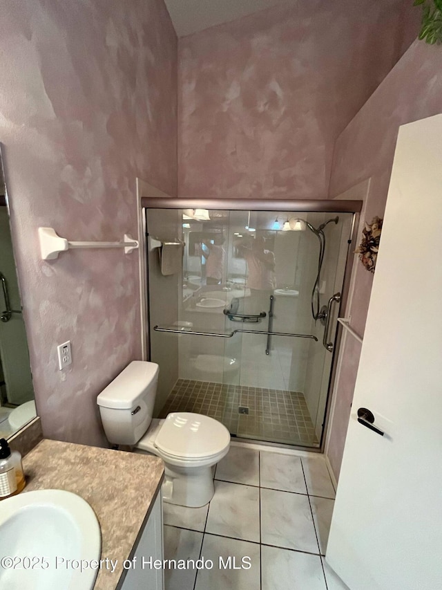 7441 Baywood Forest Cir, Spring Hill, FL 34606 - full bath with vanity, a stall shower, toilet, and tile patterned floors