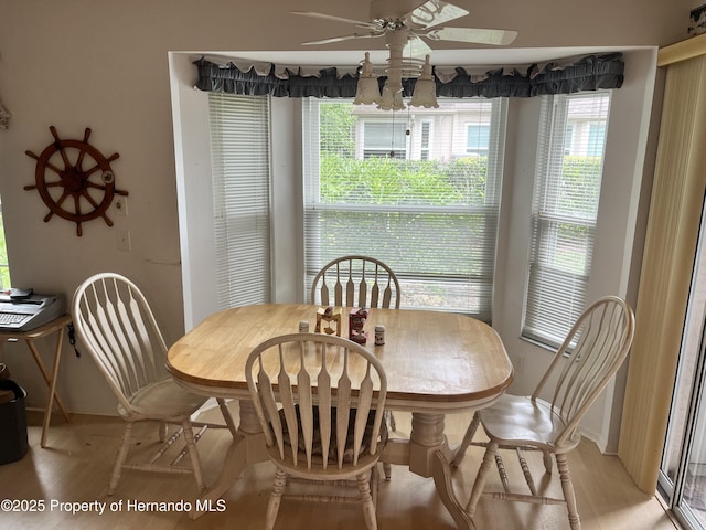 7441 Baywood Forest Cir, Spring Hill, FL 34606 - dining space with a ceiling fan, light wood-type flooring, and baseboards