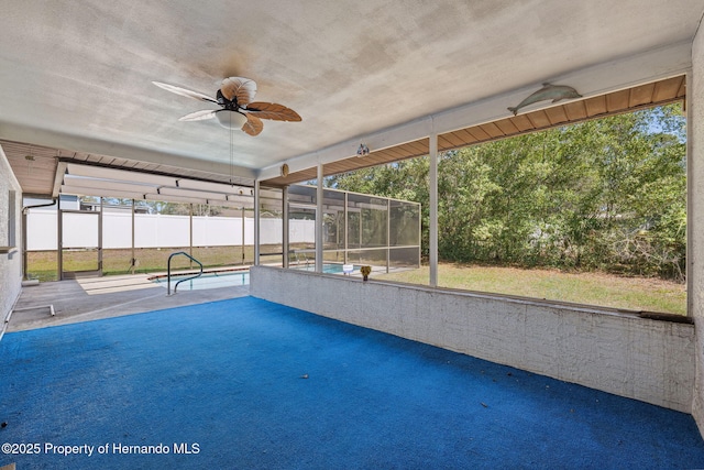 outdoor pool featuring a lanai, a patio area, fence, and a ceiling fan