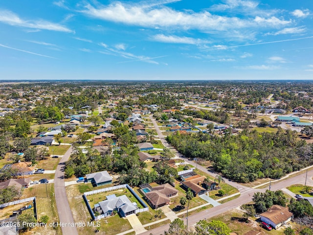 birds eye view of property with a residential view