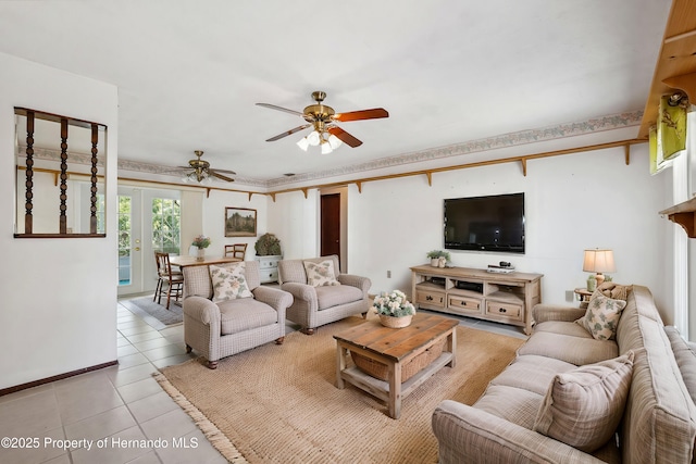 living room with a ceiling fan, french doors, and light tile patterned flooring