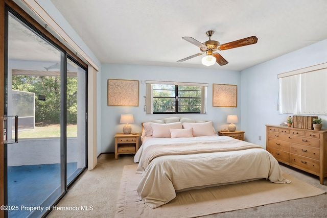 bedroom with a ceiling fan, access to outside, and light carpet