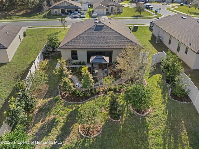 birds eye view of property with a residential view