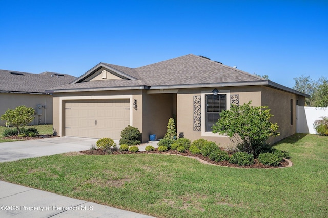 single story home with stucco siding, a shingled roof, concrete driveway, a front yard, and a garage