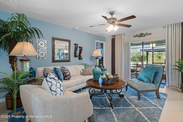 tiled living area with ceiling fan