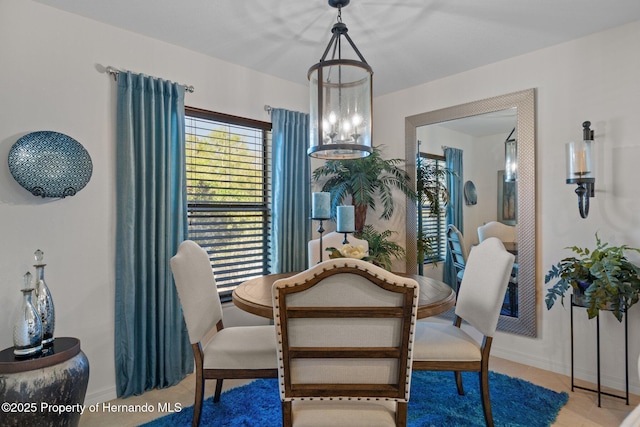 dining space with a chandelier