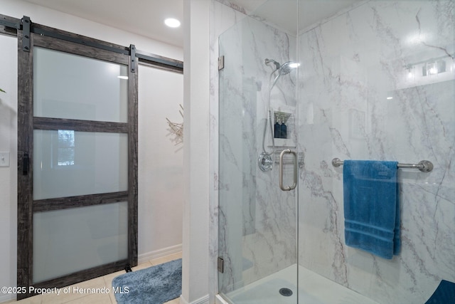 bathroom with tile patterned flooring and a marble finish shower