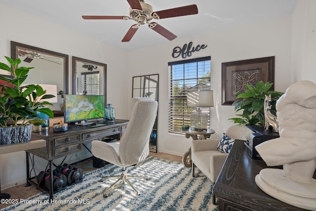 home office featuring ceiling fan and baseboards