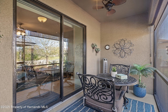 sunroom / solarium with ceiling fan