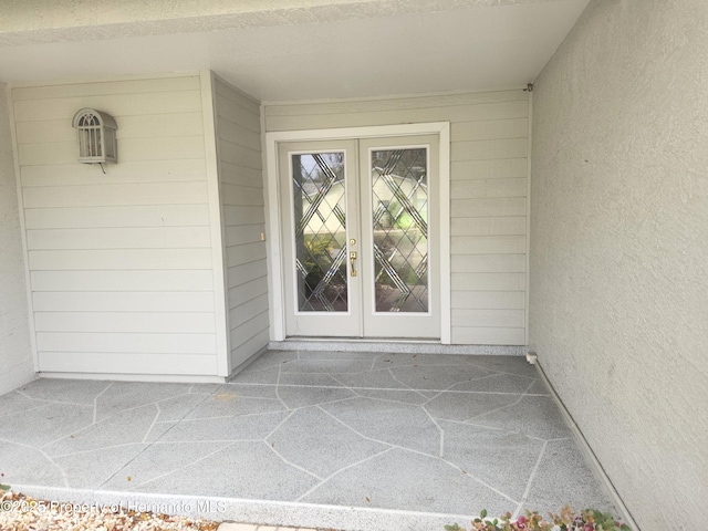 entrance to property featuring french doors