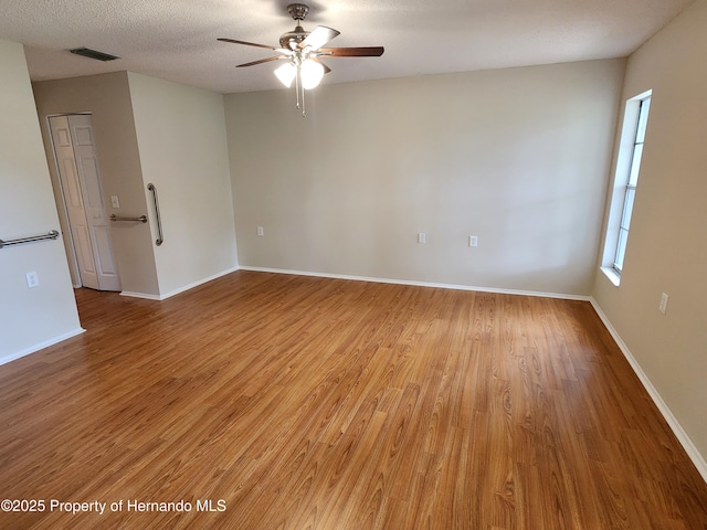 7106 Green Abbey Way, Spring Hill, FL 34606 - spare room featuring a ceiling fan, light wood-type flooring, and baseboards