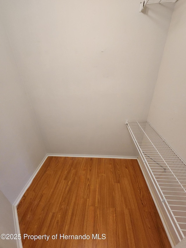 7106 Green Abbey Way, Spring Hill, FL 34606 - spacious closet with wood finished floors