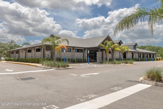 7106 Green Abbey Way, Spring Hill, FL 34606 - view of building exterior with uncovered parking