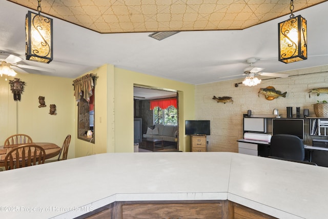 kitchen featuring light countertops and a ceiling fan