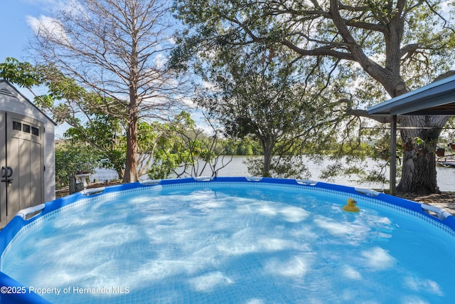 view of swimming pool with a fenced in pool