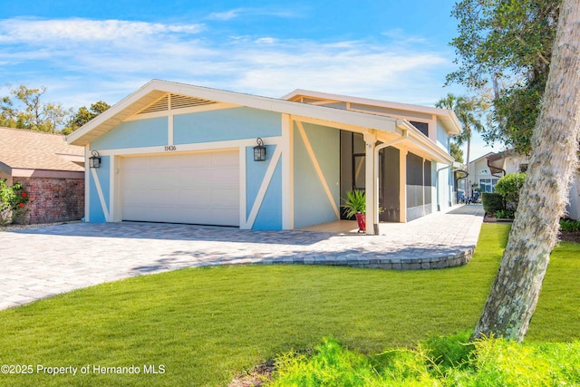 garage with decorative driveway